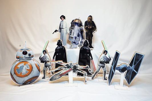 Star Wars centerpieces of Luke Skywalker, Darth Vader, Chewbacca, Princess Leia, and fighter jets